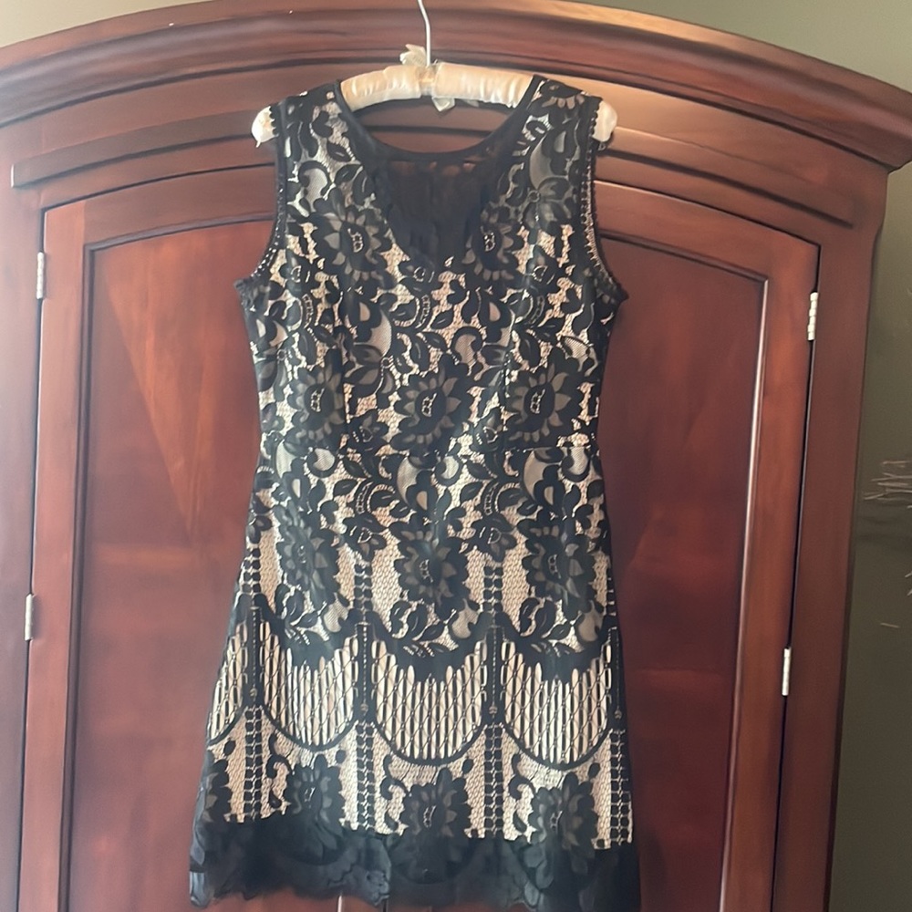 Black lace cocktail dress over cream lining. Size Large.